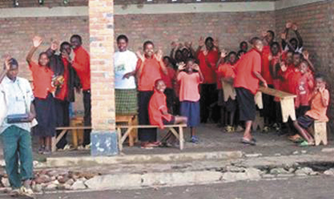 Opensided classroom at Umutara Deaf School.